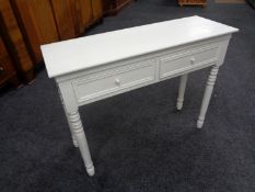 A contemporary painted two drawer hall table