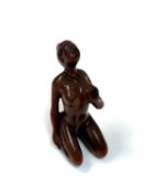 A carved Chinese hardwood miniature figure - erotic nude