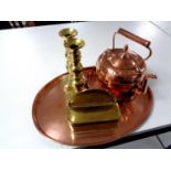 An oval copper serving tray together with a further copper embossed tray,