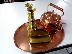 An oval copper serving tray together with a further copper embossed tray,