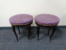 A pair of circular mahogany tapestry upholstered dressing table stools