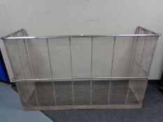 An early 20th century chrome fire guard