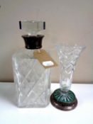 A cut glass whisky decanter with silver collar together with a further cut glass vase on silver