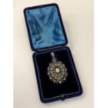 A late Victorian diamond set pendant/brooch, the main body set with 73 old-cut diamonds,