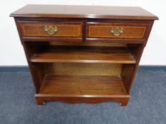 A set of inlaid mahogany open bookshelves fitted two drawers