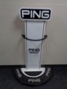 A Ping golf shop display stand