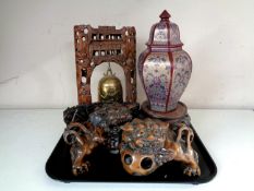 A tray containing Chinese carved hardwood gong, pair of carved wooden foo dogs,