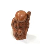 A carved Chinese hardwood netsuke - Village elder with club