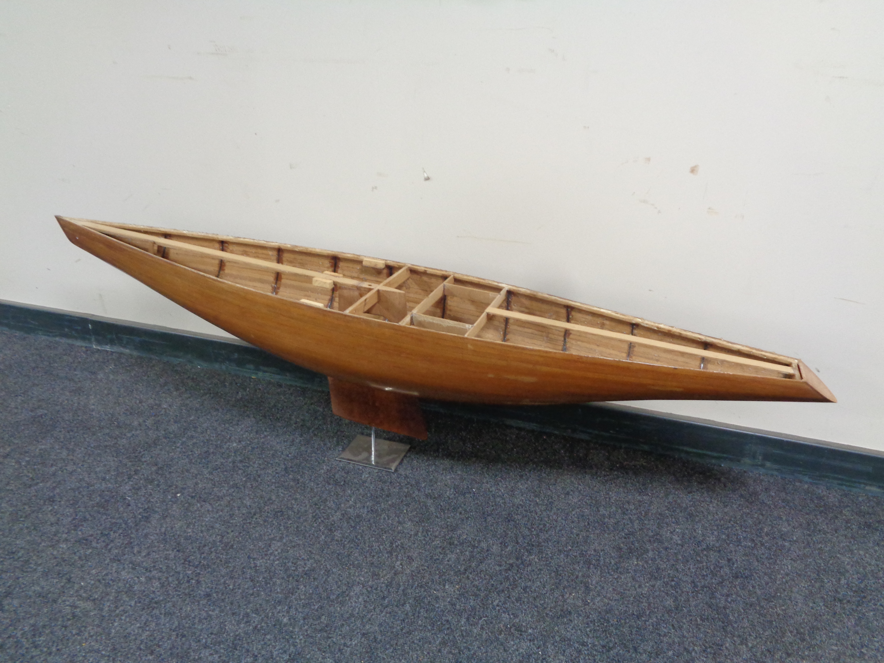 A section of a model ship on stand