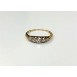 A late Victorian 18ct gold five stone diamond ring, with inscription to shank dated 1886, size N.