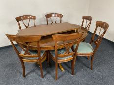 A Barker and Stonehouse oval pedestal extending dining table with leaf and set of six chairs