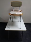 A mid 20th century melamine table and two chairs