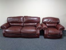 A Burgundy leather two seater settee and matching armchair
