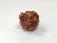 A carved Chinese hardwood netsuke - Two rats on fruit