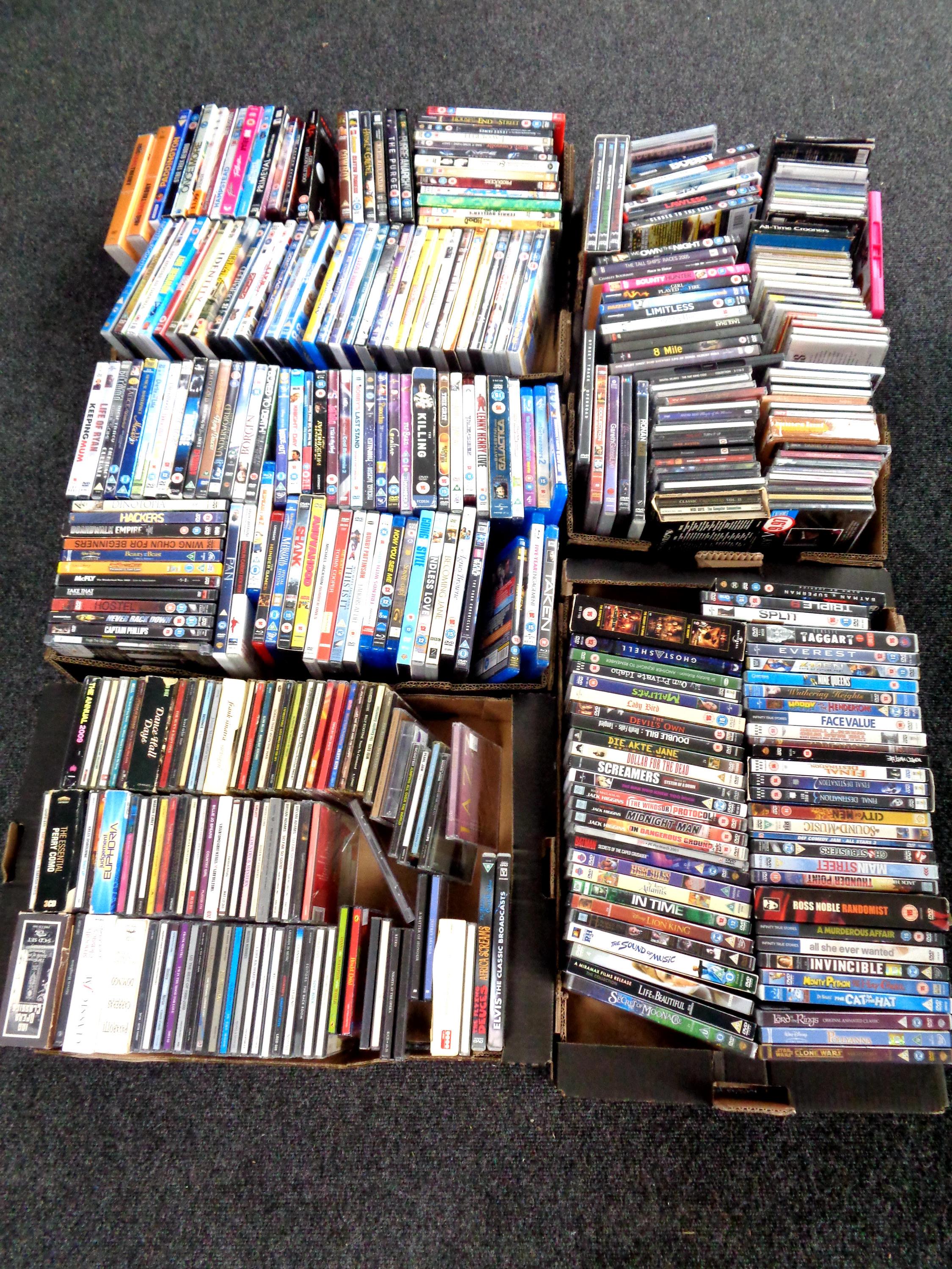 Five boxes containing a large quantity of DVDs