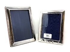 Two silver photograph frames, tallest 18 cm.