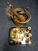 A tray containing two pairs of brass candlesticks, pair of brass model canons,