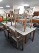 A teak garden table and six chairs