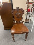A Victorian mahogany hall chair with shield back