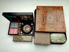 A tray containing cased miniature roulette wheel, parquetry inlaid box,