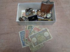 A box containing 20th century foreign bank notes, hip flask, coinage, wristwatches,