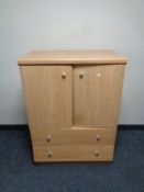 A contemporary pine effect three drawer chest together with corner stand,