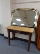 An ebonised and gilt overmantel mirror and an antique pine single drawer hall table