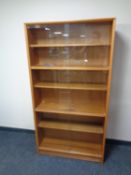 A set of teak sliding glass door bookshelves