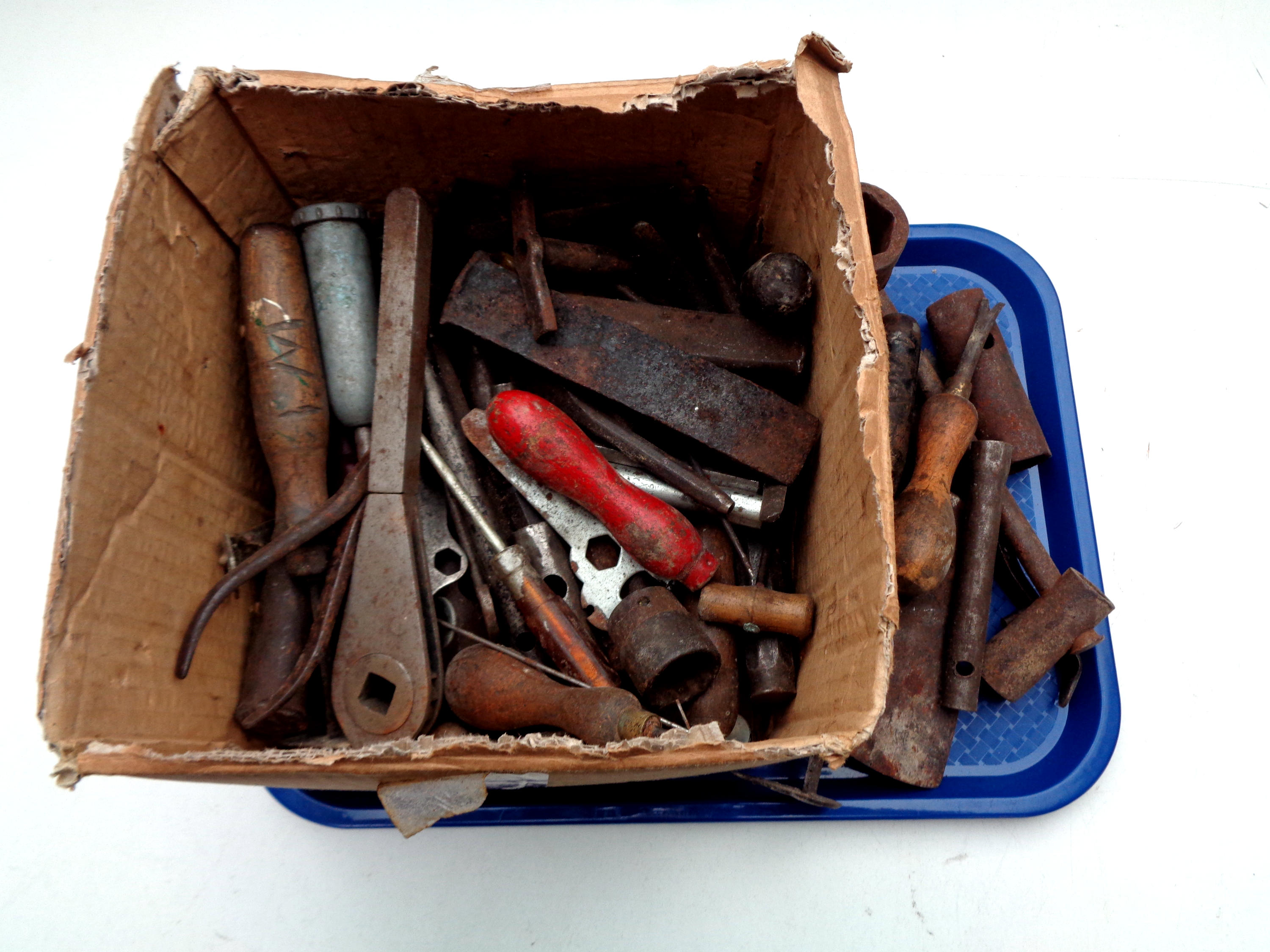 A small box containing vintage hand tools,