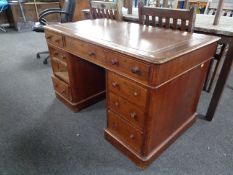 A Victorian mahogany twin pedestal writing desk with tooled leather inset panel (as found) together