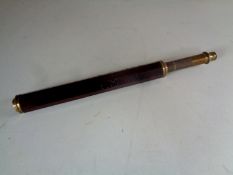 An early 19th century oak and brass telescope with carved signature E M 1804