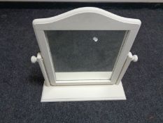 A cream painted dressing table mirror