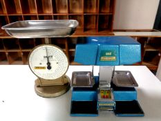 A set of Omal money scales together with a set of Salter coin scales