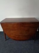 A Victorian mahogany drop leaf dining table