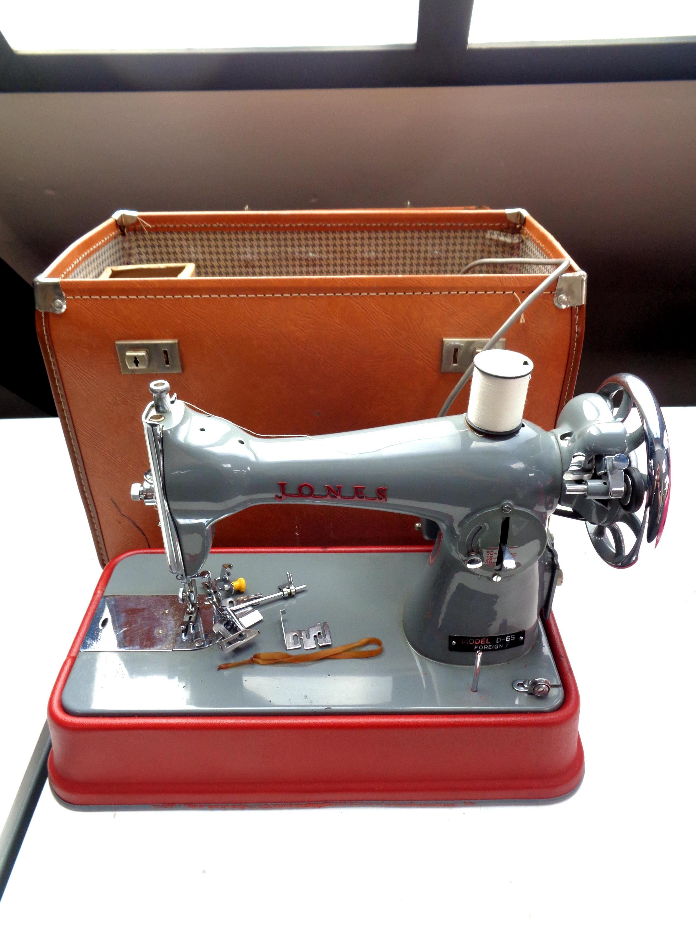 A Jones model D-65 sewing machine in case