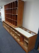 A set of 20th century plywood 32 hole haberdashers shelves together with two haberdashery counters