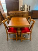 An oak dining room suite comprising carved oak sideboard,