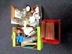 Three boxes containing miscellaneous including framed pictures, Toby jug, cash tin, dumbbells,