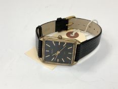 A Sekonda gold plated wrist watch on black leather strap