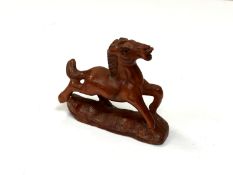 A carved Chinese hardwood netsuke - Small foal