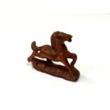 A carved Chinese hardwood netsuke - Small foal