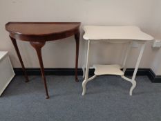 A walnut demi lune console table and a painted occasional table