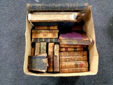 A box containing a collection of antiquarian leather bound volumes to include The History of