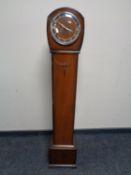 An oak granddaughter clock