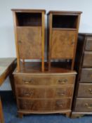 A pair of mahogany bedside cabinets together with a mahogany chest of three drawers