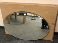 An oval plain glass mirror
