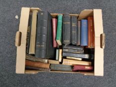 A box containing antiquarian and later volumes including Holy Bibles, hymn books,