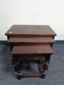 A nest of three oak tables