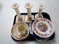 A tray containing a pair of Royal Creamware candlesticks, a further pierced candlestick,
