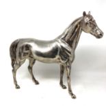 An impressive continental cast silver model of a thoroughbred horse,